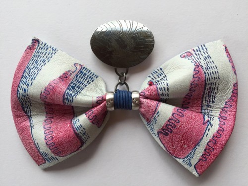 Hand painted leather bow on silver brooch