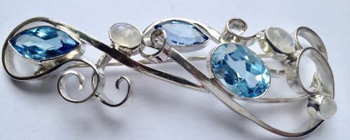 Solis silver flat curl design brooch with Moonstone and Blue topaz