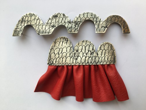 brooch with skirt, etched silver, leather